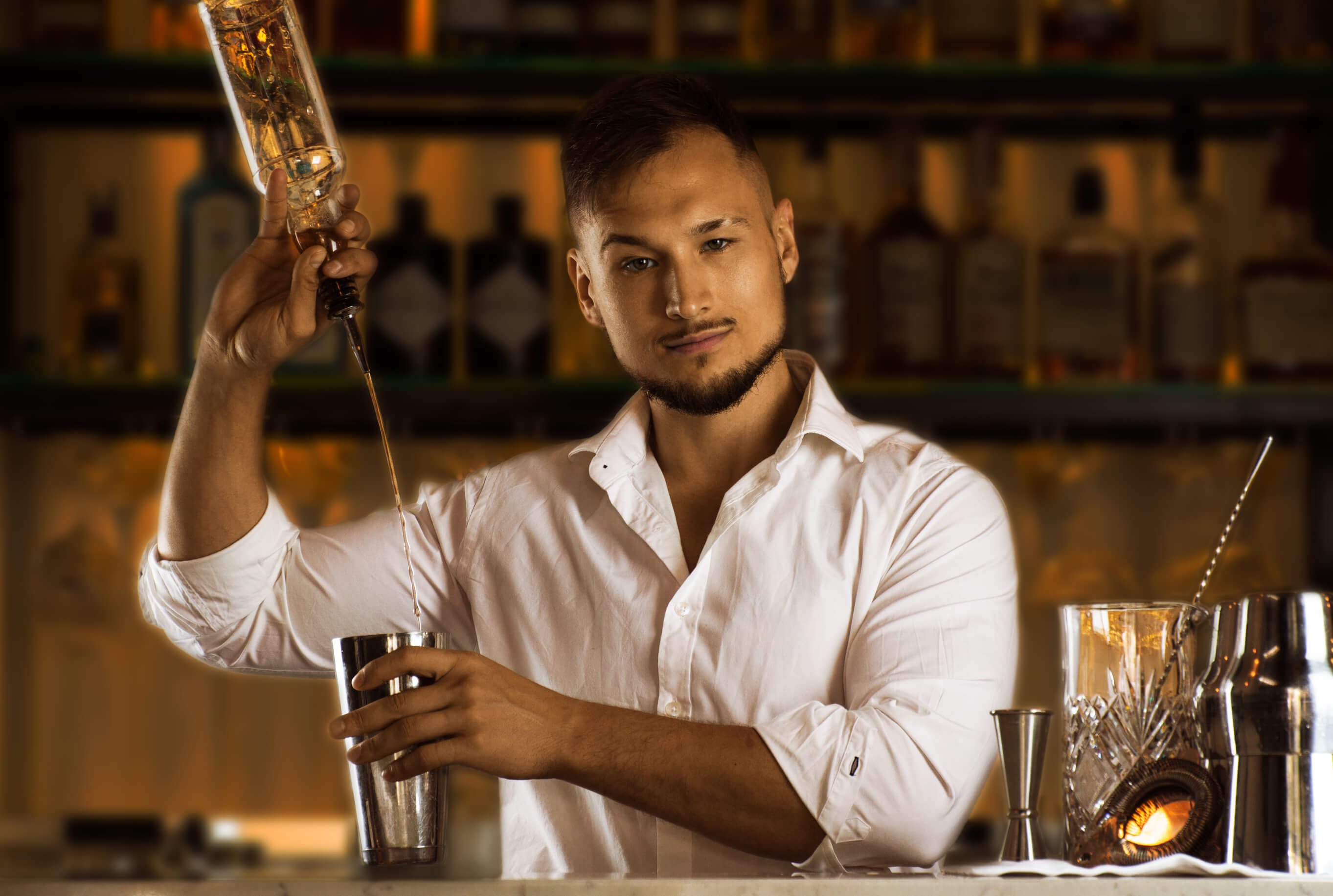 Cocktail making lesson with a sexy bartender photo